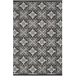 Nourison Aloha ALH-34 rug in black and white features a bold geometric pattern, perfect for modern interiors and outdoor spaces.