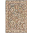 Nourison Petra PTR-01 Blue rug with intricate patterns, featuring shades of blue and ivory, beautifully displayed on a hardwood floor.