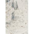 Nourison Desire DSR-04 rug in ivory, grey, and blue on a hardwood floor, showcasing its detailed pattern and plush texture.