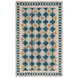 Safavieh Aspen APN-121 rug in navy and yellow, hand-tufted design, showcased on a warm-toned wood floor, enhancing room ambiance.