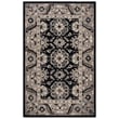 Safavieh Aspen APN-129 Black, Ivory rug displayed in a cozy setting, showcasing its hand-tufted craftsmanship and rich colors.