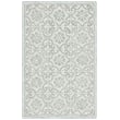 Lauren by Ralph Lauren Hand-Tufted rug in teal and ivory, featuring intricate patterns, perfect for adding elegance to any modern living space.