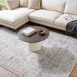 Our PNW Home x Livabliss Olympic 533671 rug in light blue, grey, and tan enhances a cozy living room setting with its elegant design.