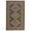 Capel Shakta Kazak Green, Blue, Purple rug with intricate patterns. Hand-tufted design showcasing vibrant colors on a hardwood floor.