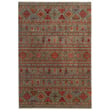 Capel Kindred Kilim rug in blue, terracotta, and tan displayed on a wooden floor, highlighting its intricate pattern and texture.
