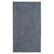 Capel Worcester Braided Blue rug, featuring a blend of blue hues in a braided design, adds a cozy touch to your living room decor.