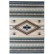Cozy living room with Capel Julius Navajo Gray, Blue, Ivory rug featuring intricate patterns; crafted from durable Olefin material.