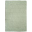 Capel Peake Island Sage rug in a serene green tone, hand-loomed for a textured finish, displayed in a cozy, elegant setting.