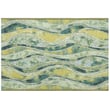 Liora Manne Esencia Wave Green rug in shades of green and cream displayed in a room setting, showcasing its modern wave pattern.