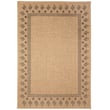 Liora Manne Sahara Block Print Border Natural rug with a geometric pattern in earthy tones displayed in a cozy indoor setting.