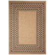 Liora Manne Sahara Diamond Border Natural rug with a geometric pattern featuring neutral tones, enhancing a cozy living space ambiance.