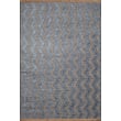 Liora Manne Mercer Zigzag Blue rug featuring a bold zigzag pattern in blue and white tones, enhancing a modern living room setting.