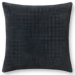 Loloi Rugs PLL-0130 Pillow in dark navy with a textured cotton design sits on a cozy couch, enhancing the living room ambiance.