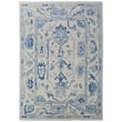 Hand-knotted Feizy Rugs Karina 90969G7F in ivory and blue, featuring intricate patterns, perfect for a stylish living room setting.