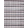 Chilewich Woven Heddle Dogwood 004 rug in soft neutral tones displayed in a modern room with hardwood floors and contemporary decor.