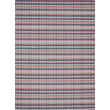 Chilewich Woven Heddle Parade 002 rug showcasing a modern, striped design with earthy tones in a living room setting.