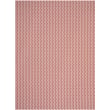 Chilewich Woven Swing Paprika (002) rug in vibrant paprika hue displayed on a hardwood floor, highlighting its rich texture and modern design.