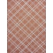 Chilewich for Martha Stewart Woven Ribbons rug in Burnt Coral displayed on a hardwood floor; features intricate woven design pattern.