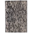 Nanimarquina Doblecara Design 1 rug in black and white, hand-knotted, displayed in a modern living space with wooden floors.
