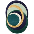 Toulemonde Bochart Alliances Forest rug, hand-tufted, in earthy tones of green and brown, displayed in a minimalist living room setting.