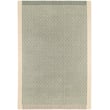Toulemonde Bochart Exclamation Celadon rug in soft greens, made of New Zealand wool, hand-tufted, displayed in a modern living room.