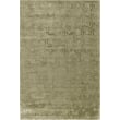 Handwoven Toulemonde Bochart Shaw Olive rug with intricate patterns in shades of green and beige displayed flat on a rustic wood floor.