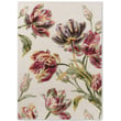 Laura Ashley for Brink and Campman Gosford Cranberry rug, hand-tufted, featuring vibrant red and pink floral patterns in a cozy setting.