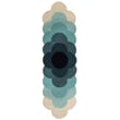 Orla Kiely for Brink and Campman Optical Flower Teal rug with a hand-tufted green and blue floral pattern on a gray background.
