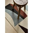 Harlequin Torillo Cornflower Walnut rug, featuring a hand-tufted design in blue and brown tones, adds elegance to a modern living room setting.