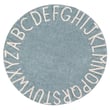 Lorena Canals ABC Washable Vintage Blue, Natural rug in a cozy living space, showcasing hand-tufted design with subtle blue and natural tones.