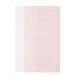 Lorena Canals Gelato Washable Reversible Rug in pastel pink and ivory, hand-tufted, displayed in a cozy room with soft lighting.