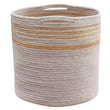 Lorena Canals Twin Reversible Basket in Natural and Amber tones, hand-made, displayed in a cozy setting with neutral decor.
