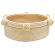Lorena Canals Basket Tray in gold and beige on display; hand-made basket showcasing intricate design and craftsmanship.