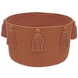 Lorena Canals New Tassels Basket in Chesnut, hand-made, showcasing rich brown tones with elegant tassels in a cozy home setting.