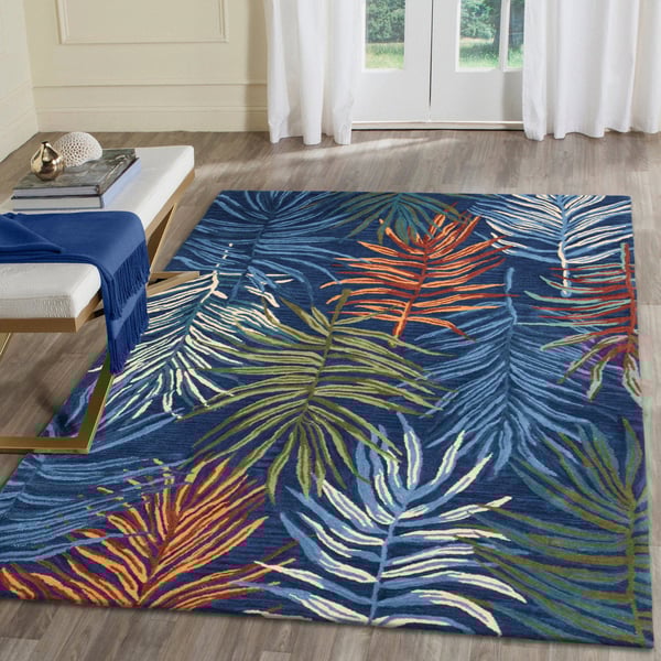 Liora Manne Tivoli La Palma Navy rug, hand-tufted, with a lush floral design in blue and beige, graces a cozy, modern living room.