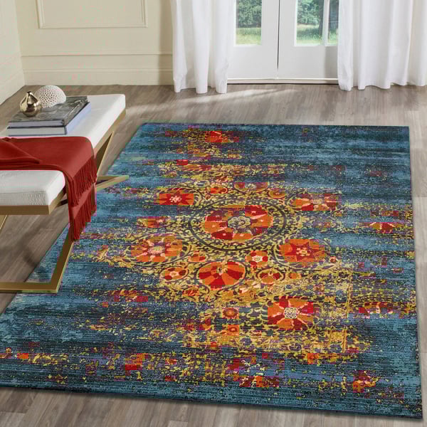 Liora Manne Marina Suzanie Blue rug in a vibrant room setting, featuring intricate patterns in shades of blue and white.